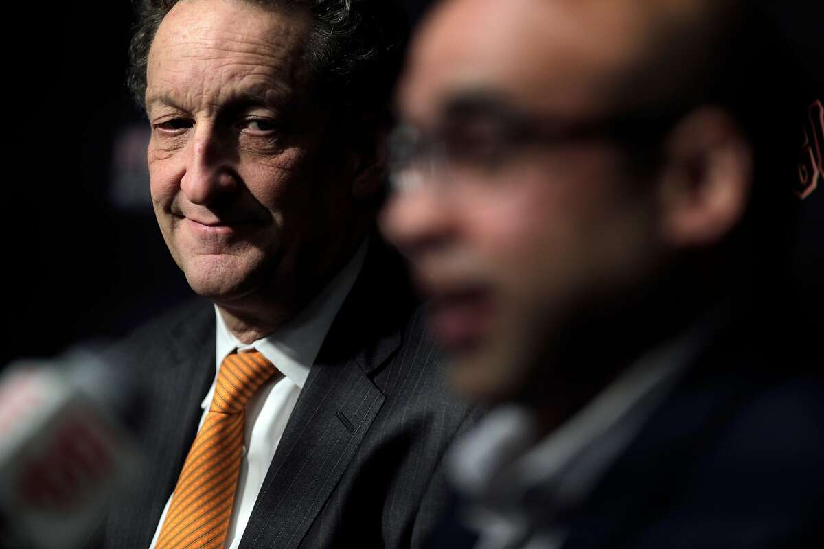 Giants CEO Larry Baer listens to Farhan Zaidi answer a question after he introduced Zaidi as the new president of baseball operations during a press conference at AT&T Park, in San Francisco, Calif., on Wednesday, November 7, 2018.