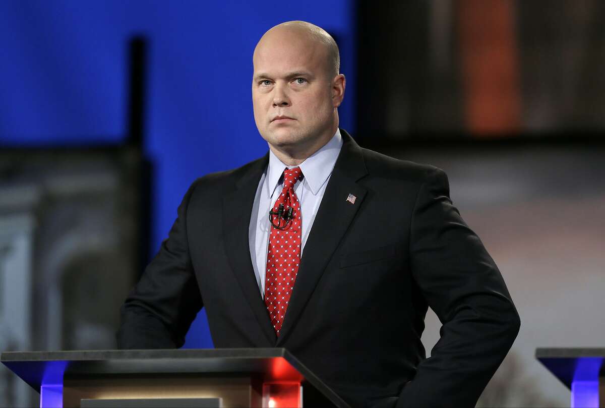 FILE - In this April 24, 2014, file photo, then-Iowa Republican senatorial candidate and former U.S. Attorney Matt Whitaker watches before a live televised debate in Johnston, Iowa. President Donald Trump announced in a tweet that he was naming Whitaker, as acting attorney general, after Attorney General Jeff Sessions was pushed out Nov. 7, 2018, as the country's chief law enforcement officer after enduring more than a year of blistering and personal attacks from Trump over his recusal from the Russia investigation. (AP Photo/Charlie Neibergall, File)