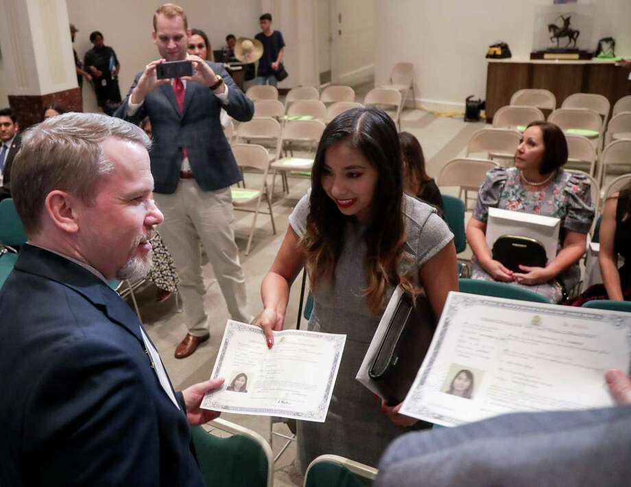 Fifty take citizenship oath at Houston City Hall - Houston Chronicle
