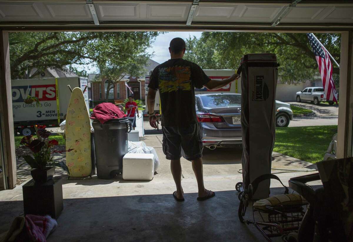 Matt Sprague packs up the last of his belongings from his family's home in west Houston after closing on the sale of the home, Thursday, Aug. 30, 2018 in Houston. Sprague had an offer on the house virtually overnight using the web-based service Opendoor.