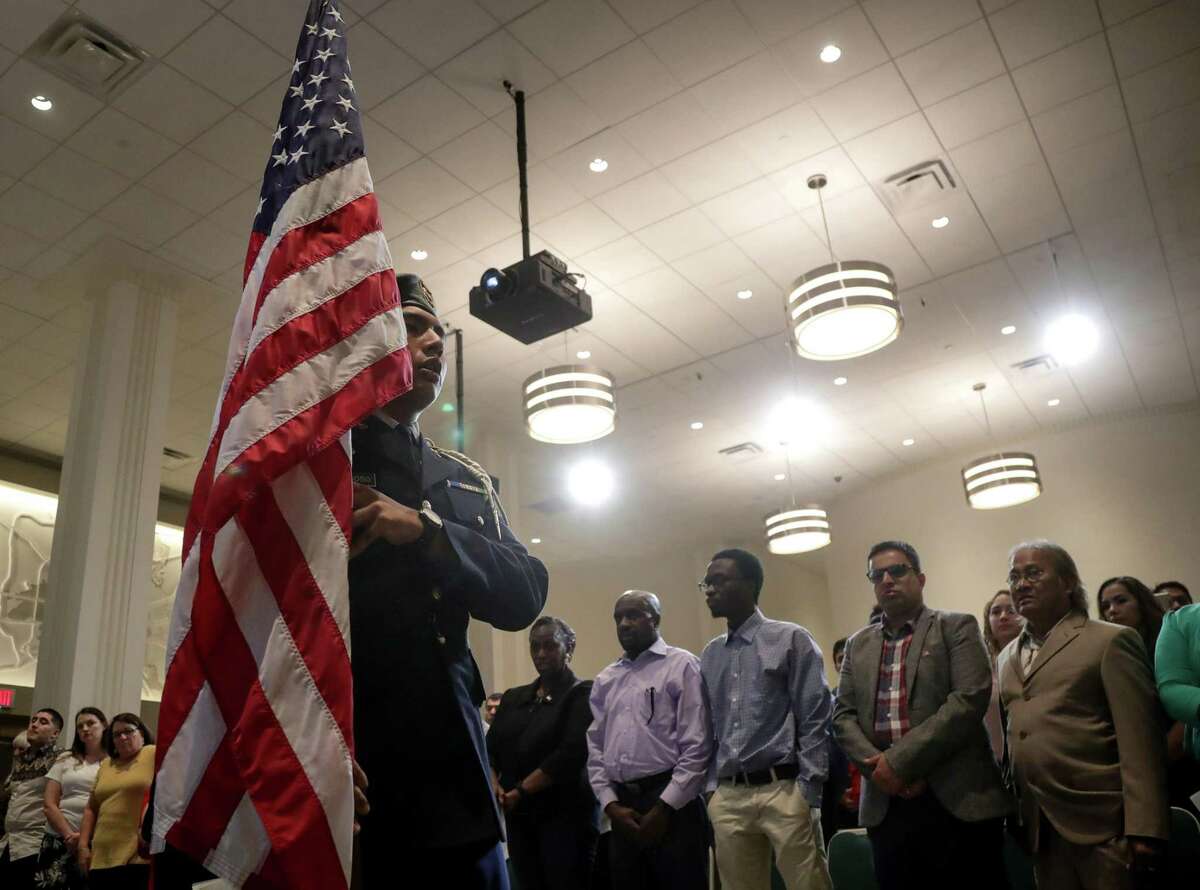 Fifty take citizenship oath at Houston City Hall