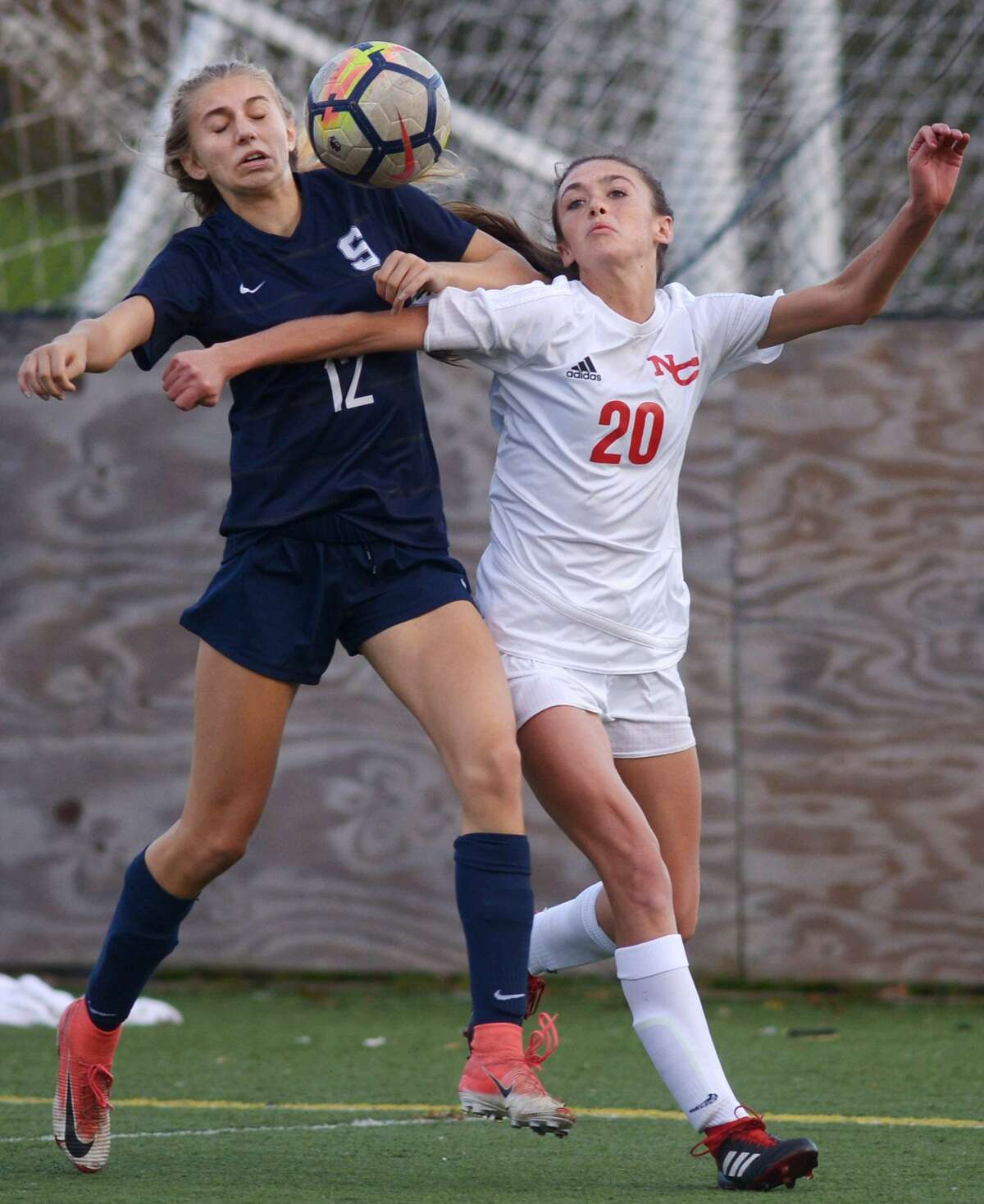 Wrecker #12 Cailyn Lesher and Ram #20 Emma Schuh battle for the ball as the Staples High School Wreckers take on the New Canaan High School Rams in their Class LL girls soccer game Wednesday, November 7, 2018, at Wakeman Fields in Westport, Conn.