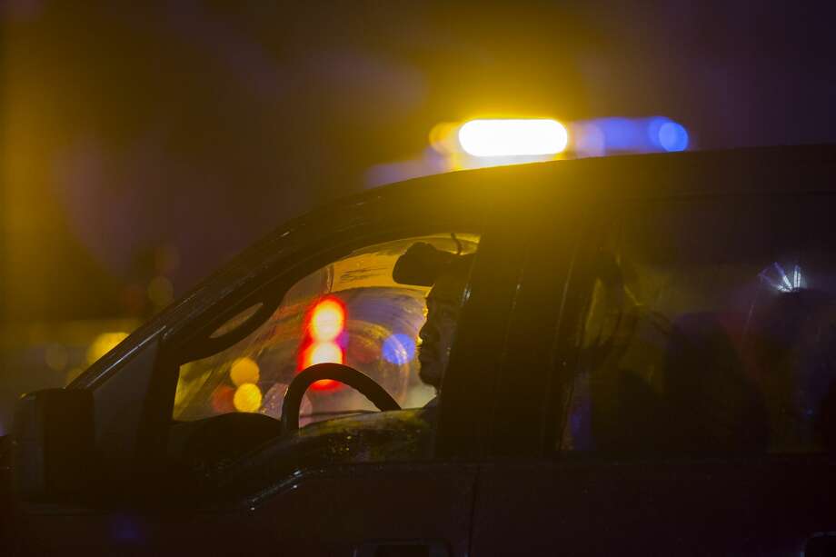 A passing motorist looks at the seen near the Borderline Bar and Grill, where a mass shooting occurred, on November 8, 2018 in Thousand Oaks, California. At least 12 people have died, including a Ventura County Sheriffs Department sergeant, plus the gunman. Photo: David McNew/Getty Images