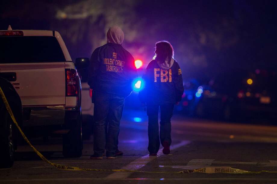 F.B.I. agents monitor the scene near the Borderline Bar and Grill, where a mass shooting occurred, on November 8, 2018 in Thousand Oaks, California. According to reports, at least 12 people have died, including a Ventura County Sheriffs Department sergeant, plus the gunman. Photo: David McNew/Getty Images
