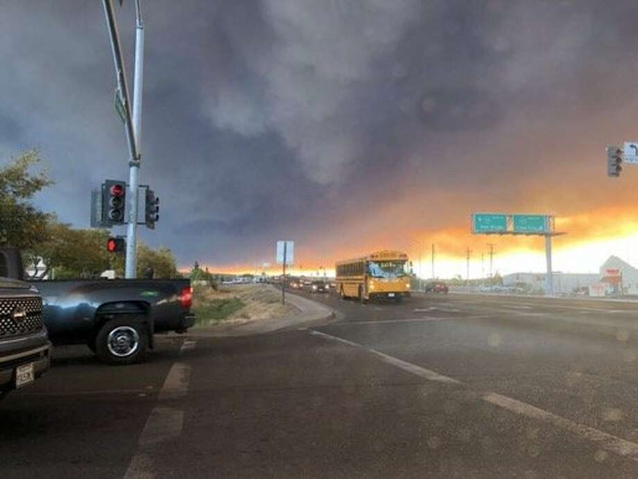 Twitter user jackieglazerr captured dark plumes of smoke from the Camp Fire filling the sky over Fair Street in Chico. Photo: Twitter
