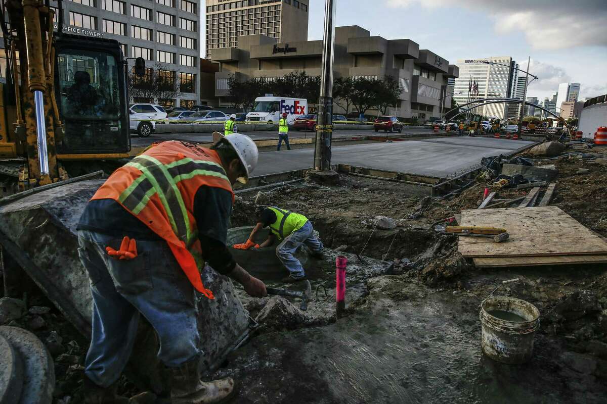 Construction crews work along Post Oak Boulevard on Feb. 14, 2018 in Houston. Construction costs have been on the rise according to an analysis of federal data by the Associated General Contractors of America.