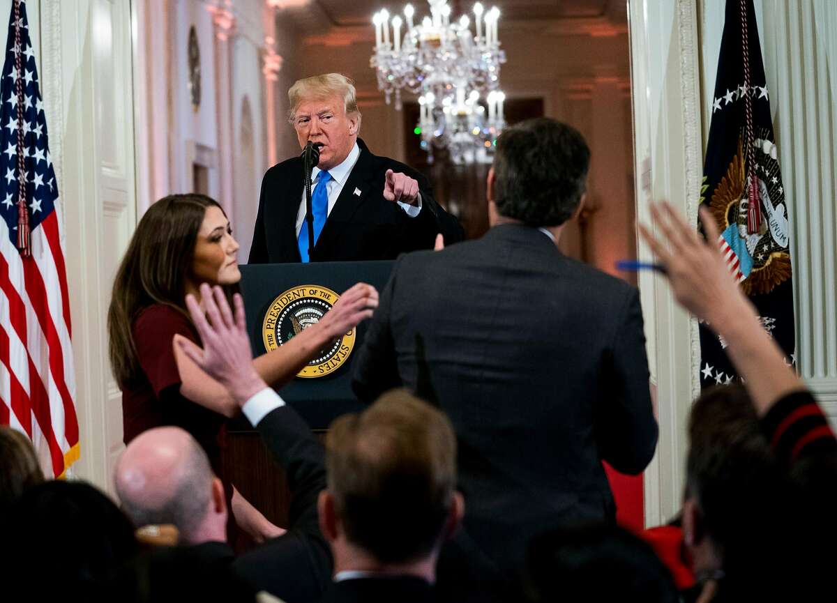 President Donald Trump has a heated exchange with CNN reporter Jim Acosta while a White House aide tries to pull the microphone away from Acosta, at a news conference about the results of the midterm elections, at the White House in Washington, Nov. 7, 2018. (Doug Mills/The New York Times)