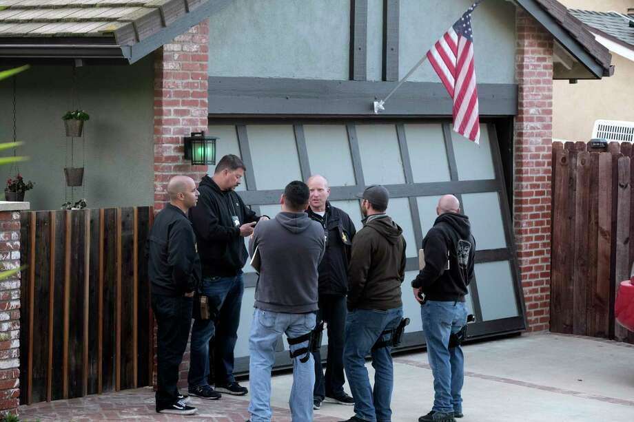 Ventura County Sheriff's deputies stand outside the house of shooting suspect David Ian Long in Newbury Park, Calif., on Thursday, Nov. 8, 2018. Authorities said the former Marine opened fire at a country music bar in Southern California on Wednesday evening. Photo: Richard Vogel, AP / Copyright 2018 The Associated Press. All rights reserved.