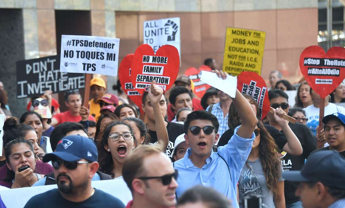 (FILES) In this file photo taken on September 1, 2017 young immigrants and supporters walk holding signs during a rally in support of Deferred Action for Childhood Arrivals (DACA) in Los Angeles, California. - The Trump administration is seeking the conservative-leaning Supreme Court's endorsement to kill the "Dreamers" program, which protects about 1.8 million undocumented immigrants who arrived in the United States as children. Late November 5, 2018 the Justice Department announced it was bypassing regional appellate benches and going straight to the high court to gain support for its effort to end the Obama-era Deferred Action for Childhood Arrivals (DACA) program. (Photo by FREDERIC J. BROWN / AFP)FREDERIC J. BROWN/AFP/Getty Images
