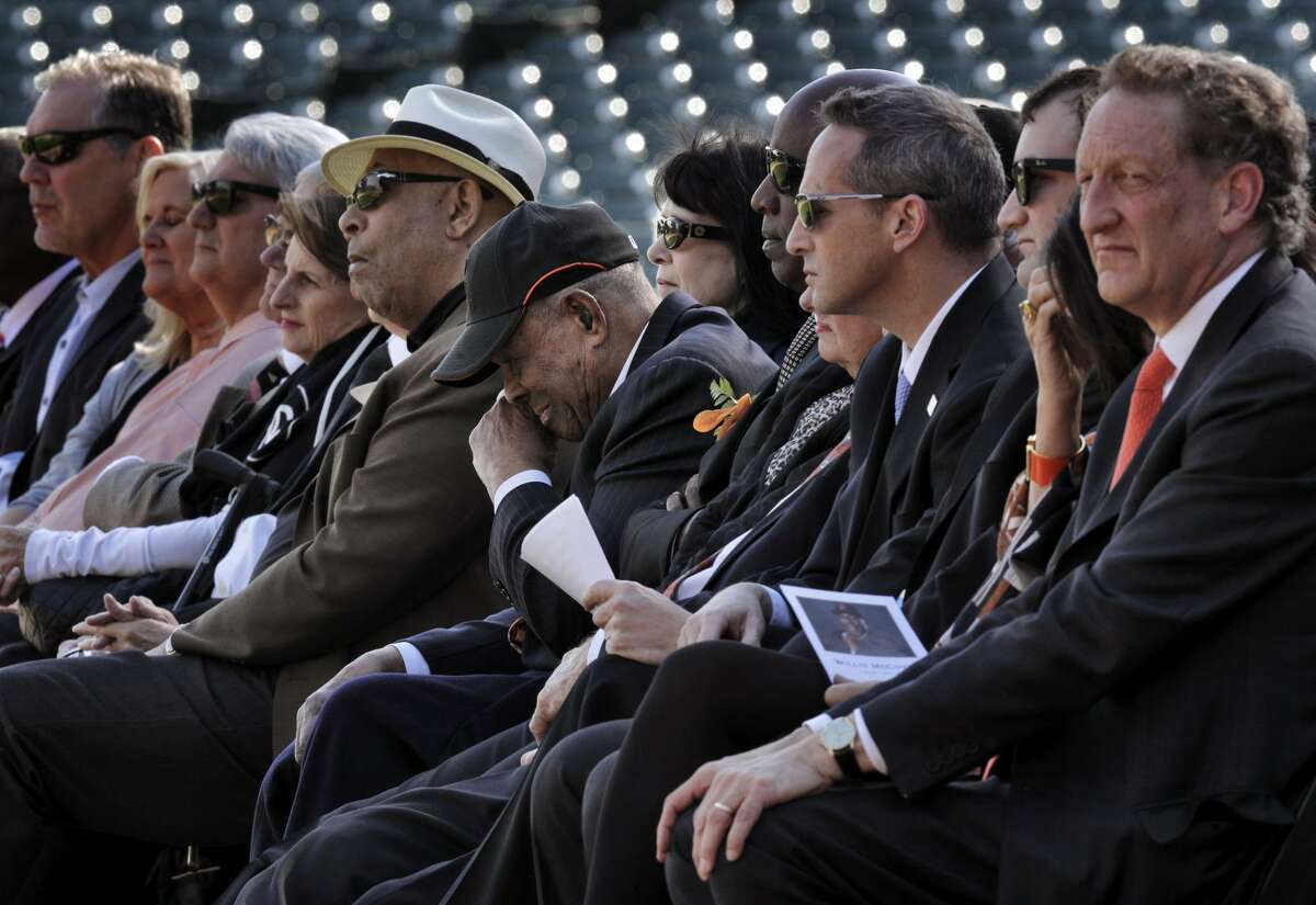 Estela McCovey, Willie McCovey's wife, is comforted by her former