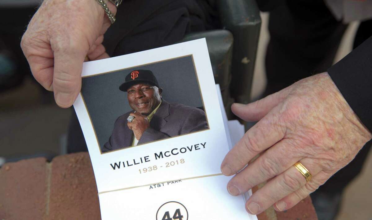 Estela McCovey, Willie McCovey's wife, is comforted by her former