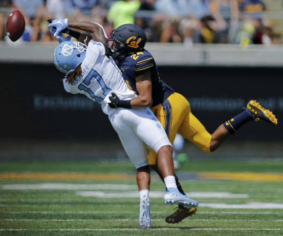 California Golden Bears cornerback Camryn Bynum (24) breaks up the pass against the North Carolina Tar Heels wide receiver J.T. Cauthen (18) during an NCAA football game at Memorial Stadium, Saturday, Sept. 1, 2018, in Berkeley, Calif.