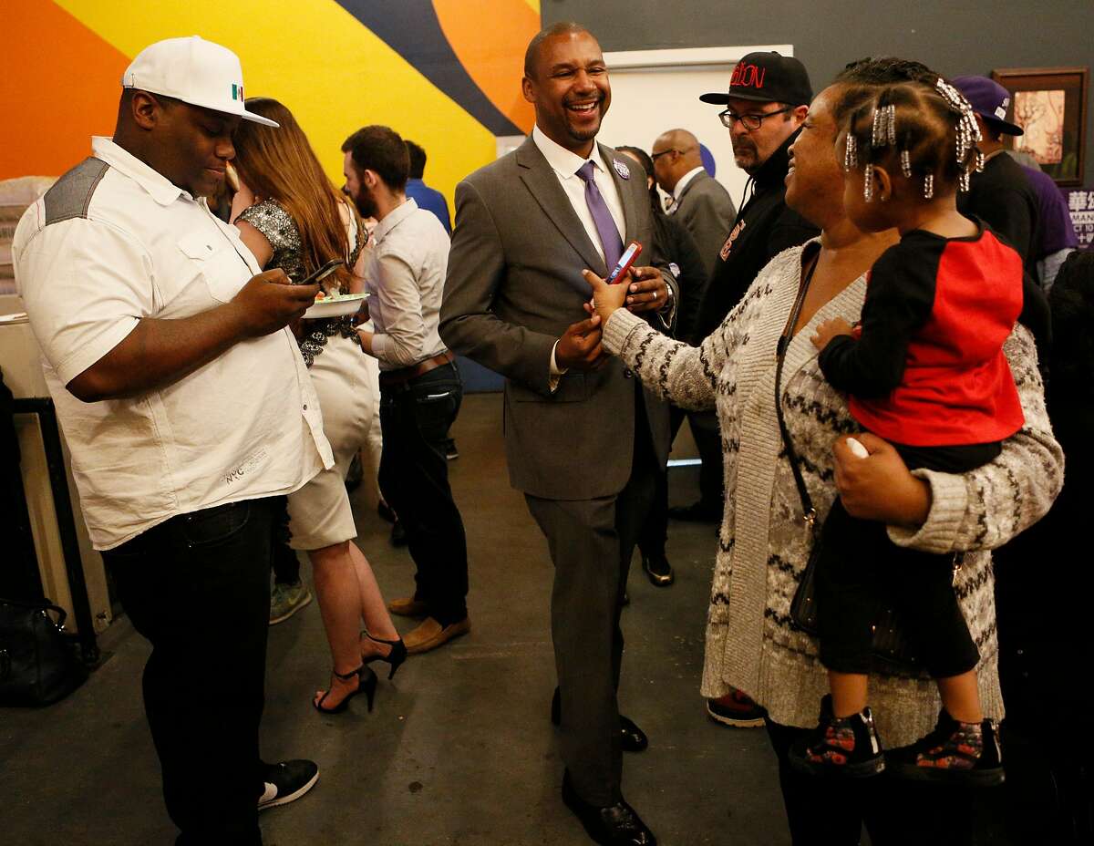 Shamann Walton, a District 10 candidate, greets his mother-in-law Grace Hamilton and niece Amoni Cole, age 2, at his watch party Tuesday, Nov. 6, 2018, in San Francisco, Calif.