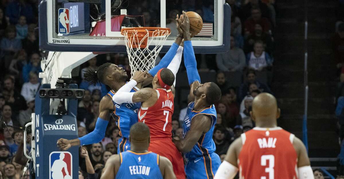 OKLAHOMA CITY, OK - NOVEMBER 8: Nerlens Noel #3 of the Oklahoma City Thunder and Patrick Patterson #54 of the Oklahoma City Thunder block Carmelo Anthony #7 of the Houston Rockets as he tries to shoot two points during the first half of a NBA game at the Chesapeake Energy Arena on November 8, 2018 in Oklahoma City, Oklahoma. NOTE TO USER: User expressly acknowledges and agrees that, by downloading and or using this photograph, User is consenting to the terms and conditions of the Getty Images License Agreement. (Photo by J Pat Carter/Getty Images)