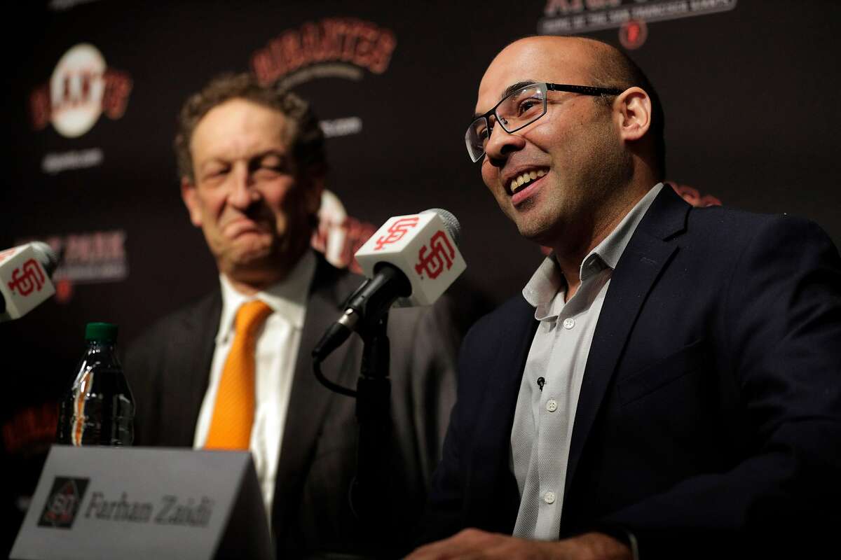 Giants CEO Larry Baer listens to Farhan Zaidi answer a question during a press conference at AT&T Park, in San Francisco on November 7, 2018.