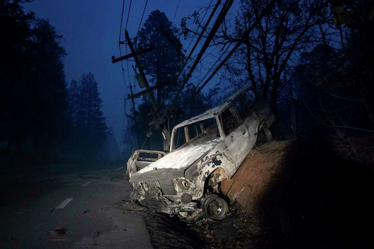 A scorched vehicle rests on a roadside as the Camp Fire tears through Paradise, Calif., on Thursday, Nov. 8, 2018. At least five people were confirmed dead Friday morning as the Camp Fire continued to rip through Butte County. The five victims were found in vehicles burned by the blaze in the area of Edgewood Lane, according to the Butte County Sheriff’s Office. The victims were not identified.