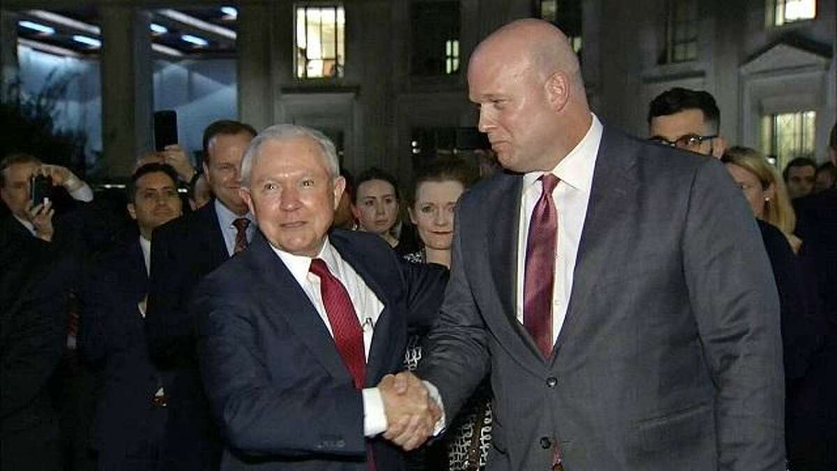 Former Attorney General Jeff Sessions shakes hands with his successor, Acting Attorney General Matthew G. Whitaker, an outspoken critic of the Mueller probe.