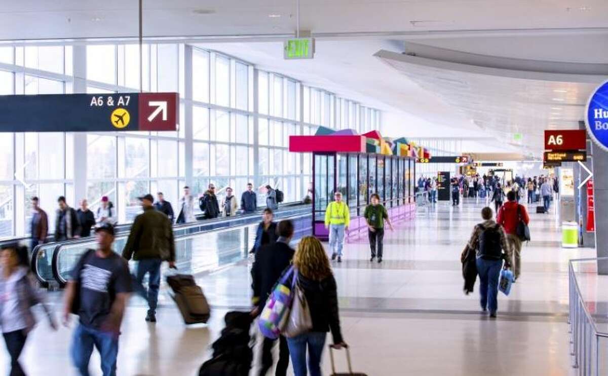 Passengers walk through Concourse A at Sea-Tac Airport.