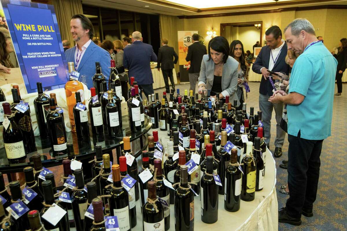 Guests peruse a table of wines during the annual Iron Sommelier competition at The Houstonian, benefiting the Periwinkle Foundation.