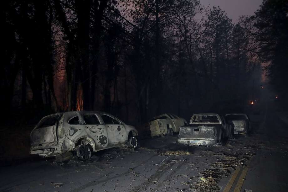 Abandoned burned out cars sit in the middle of the road after the Camp Fire moved through the area on November 8, 2018 in Paradise, California. Fueled by high winds and low humidity, the rapidly spreading wildfire has ripped through the town of Paradise, charring 18,000 acres and destroying dozens of homes in a matter of hours. The fire is currently at zero containment. Photo: Justin Sullivan/Getty Images