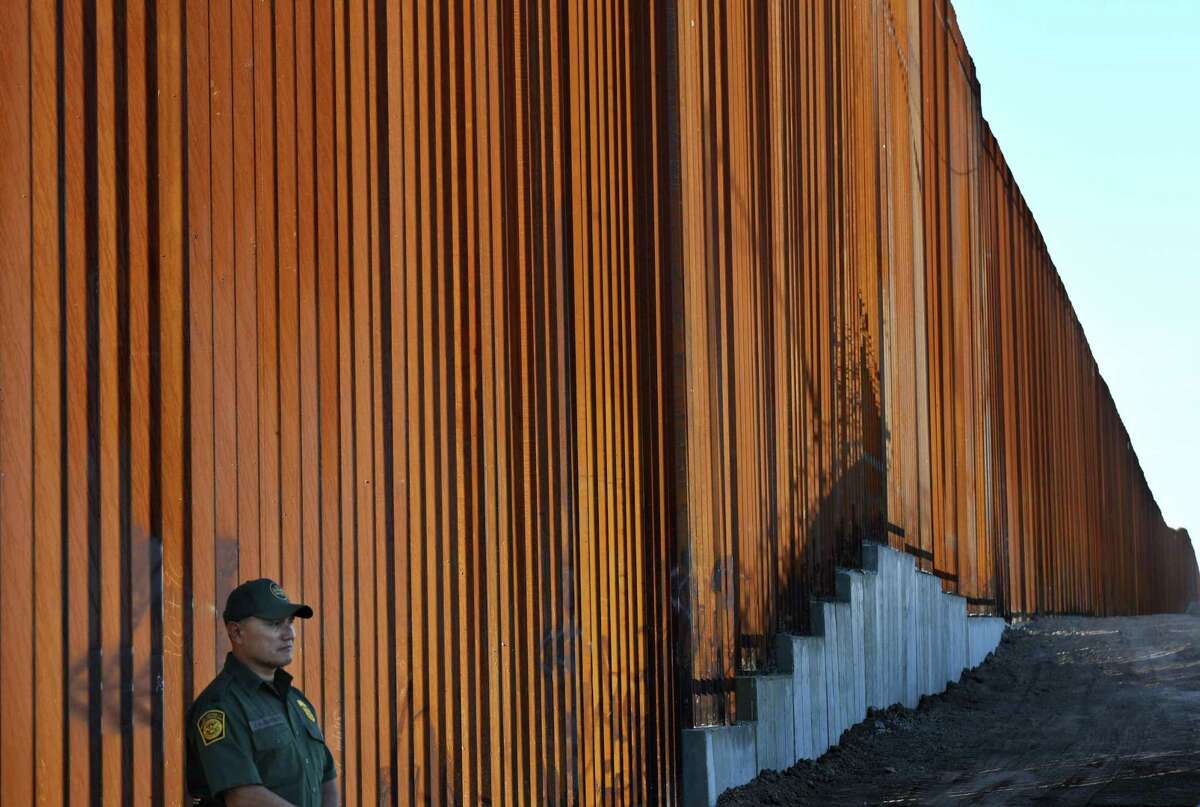 TOPSHOT - Border Patrol officers keep warch before U.S. Department of Homeland Security Secretary Kirstjen M. Nielsen inaugurates the first completed section of President Trumps 30-foot border wall in the El Centro Sector, at the US Mexico border in Calexico, California on October 26, 2018. (Photo by Mark RALSTON / AFP)MARK RALSTON/AFP/Getty Images