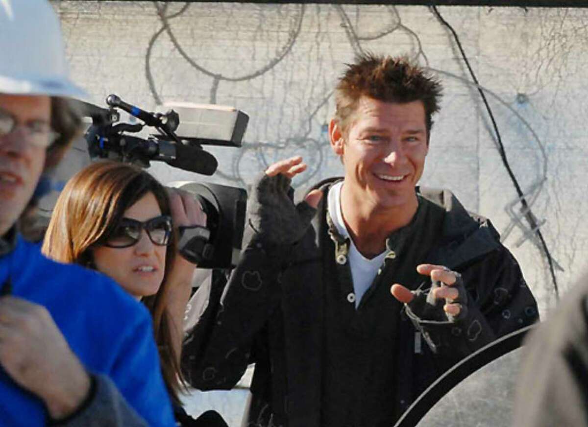 Host Ty Pennington tapes a segment on Saturday before the demolition of Debbie Oatman's home on Fairway Lane in Colonie.