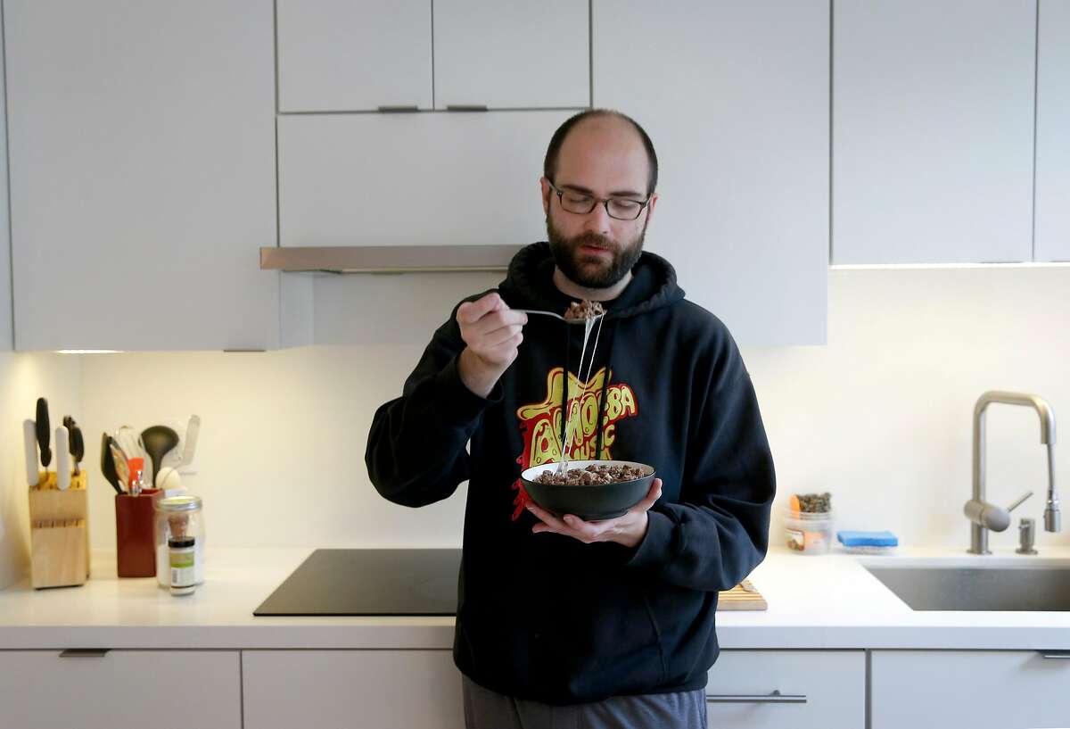 Ryan Parks consumes a carnivore breakfast of a pound of ground beef and melted provolone cheese at his home in San Francisco, Calif. on Friday, Nov. 9, 2018. Parks converted to a zero carb diet in July.