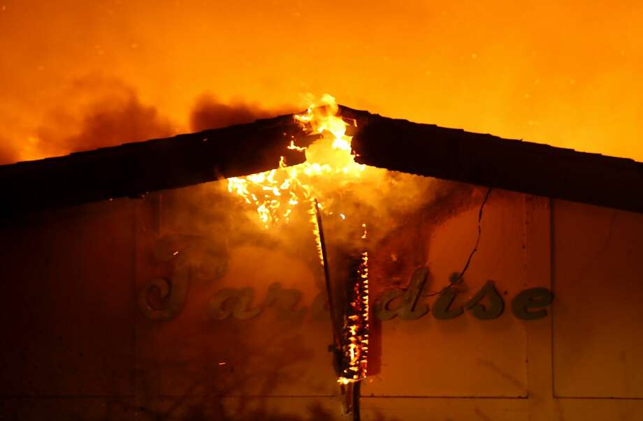 AFTER: Paradise Skilled Nursing Center, Paradise A sign attached to the Paradise Skilled Nursing Center, along with the building, burns. Photo: Justin Sullivan/Getty Images