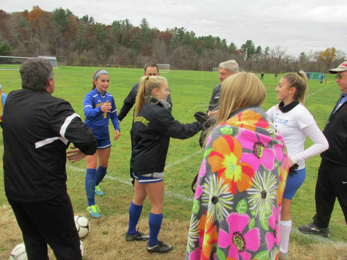 East Hampton battled through the rain for a Class S girls soccer quarterfinal win over Housatonic Friday afternoon at Housatonic High School.