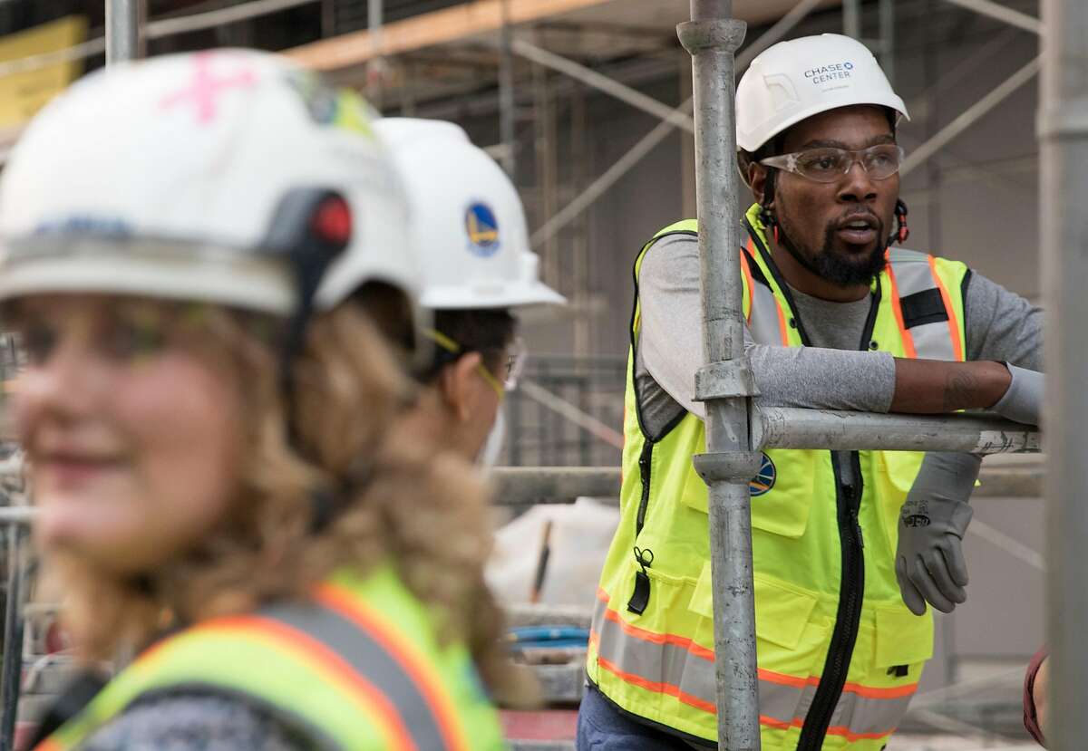 Warriors' Kevin Durant joins a tour of the Chase Center under construction along the waterfront near the Mission Bay neighborhood of San Francisco, Calif. Friday, Nov. 9, 2018.