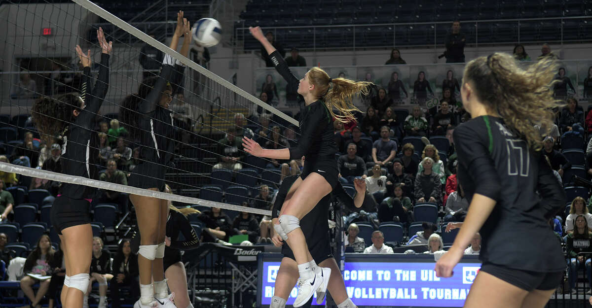 Kingwood Park senior middle blocker Katey Searcy, right, makes a play at the net against a Foster defender during the second set of their 2018 Region III 5A UIL Volleyball Regional Semi-Final matchup at Delmar Fieldhouse in Houston on Nov. 9, 2018.