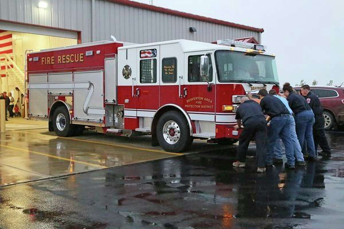 Beaverton firefighters 'Pushing In' to service the department's new 2018 Pierce Enforcer 'Engine 112.' (Photo provided)