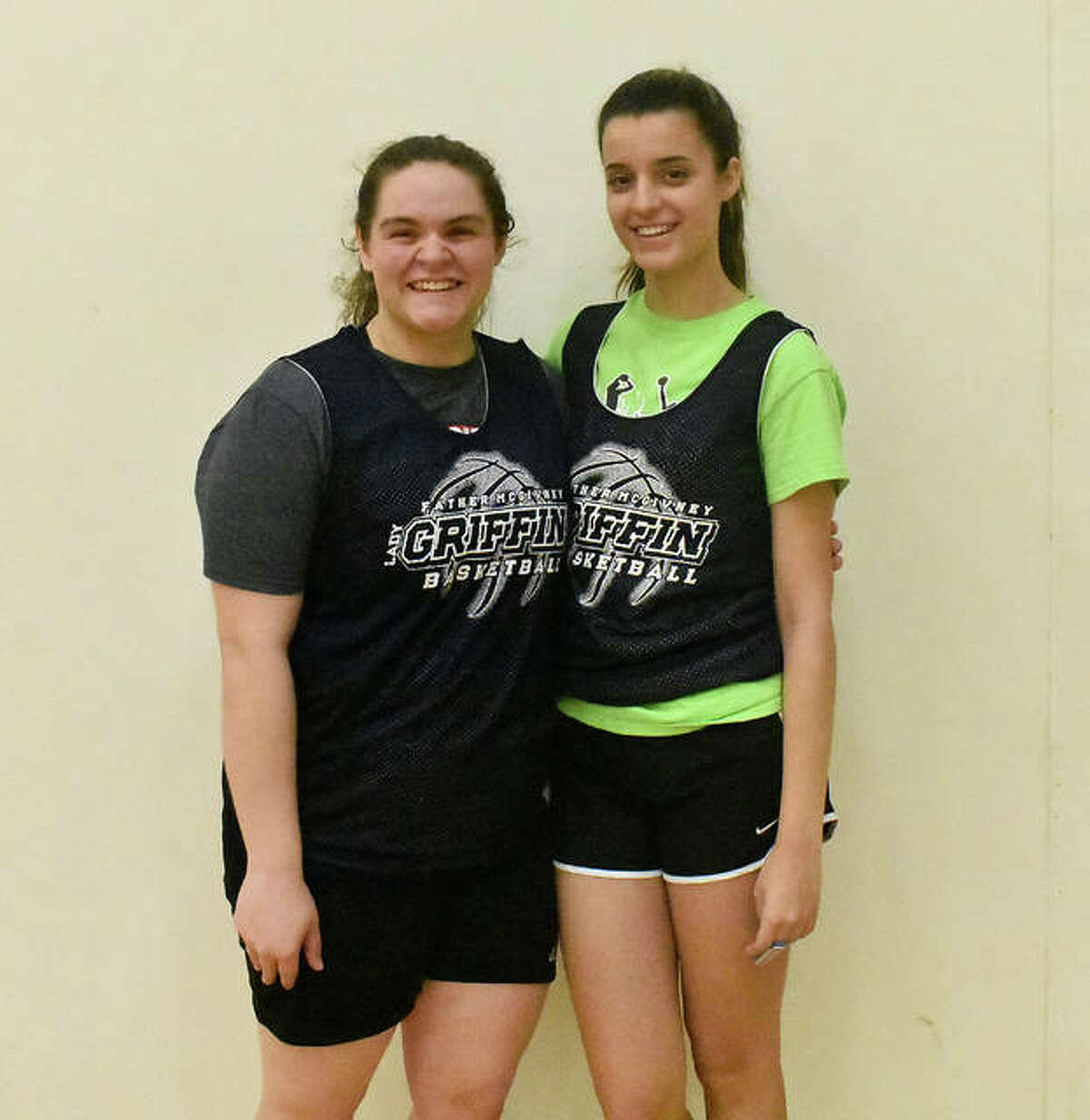 Father McGivney seniors for the girls’ basketball team include Caitlyn Pendall, left, and Nicole Luchetti.