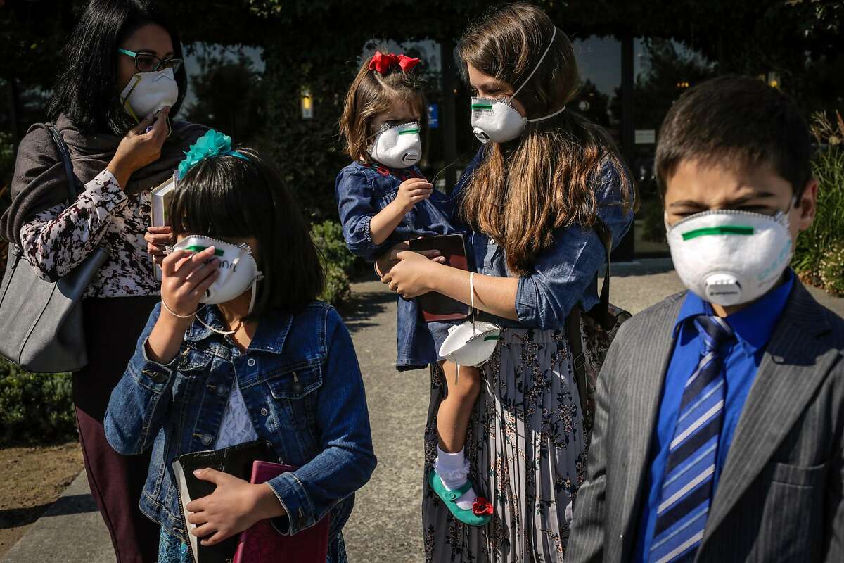 (l-r) Family members Melody Scott, Jenna Scott, 9, Olivia Scott, 3, Kaylee Scott, 12, and Daniel Scott, 9 stand outside the Doubletree Hotel after attending services with their church the New Hope Baptist Church in Rohnert Park, Calif., on Sunday, Oct. 15, 2017. The services were being held at the Doubletree because the church was in an evacuation zone due to the fires in the area. Many people were grieving the loss of homes and lives due to the destruction caused by several fires in the area.