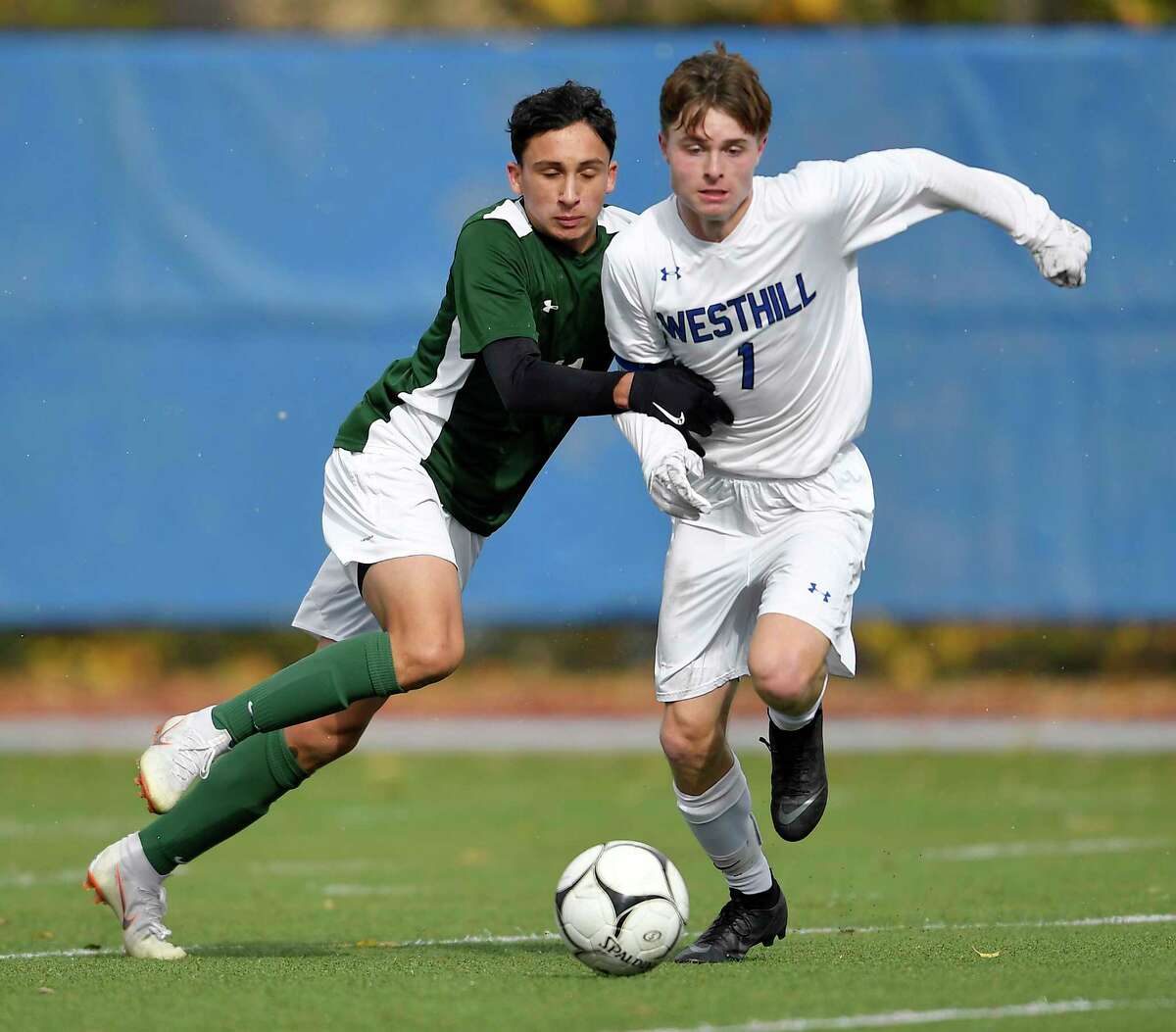 Schalmont?’s Ryan Edwards, left, challenges for the ball against Westhill?’s Charlie Bolesh during a Class B semifinal at the NYSPHSAA Boys Soccer Championships in Middletown, N.Y., Saturday, Nov. 10, 2018. Schalmont's season ended with a 3-1 loss to Westhill-III. (Adrian Kraus / Special to the Times Union)
