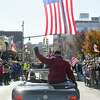 Sgt. Alan Sosnowitz, a Vietnam Army veteran, waves to the crowd in the annual Stamford Veteran’s Day Parade, commemorating 100 years since the end of WWI on Sunday.
