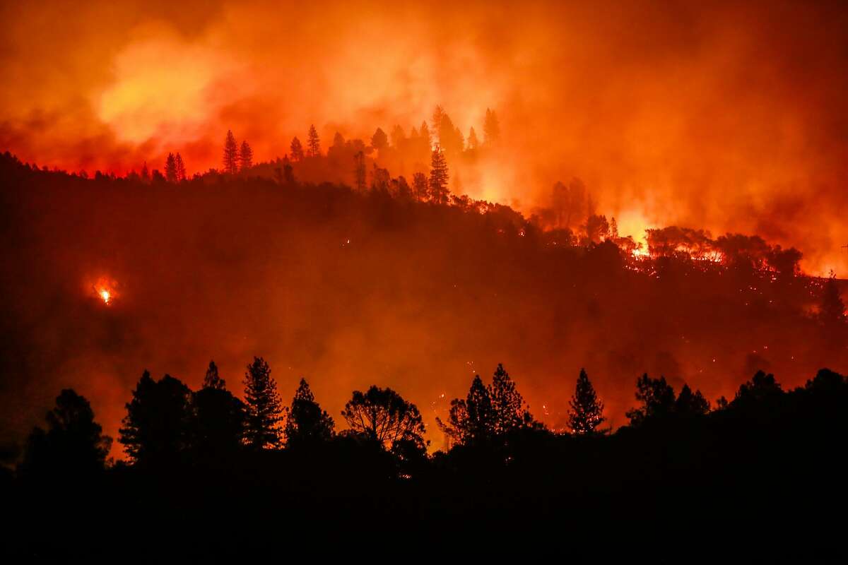 The Camp Fire burns along a ridgetop near Big Bend, Calif., on Saturday, Nov. 10, 2018.