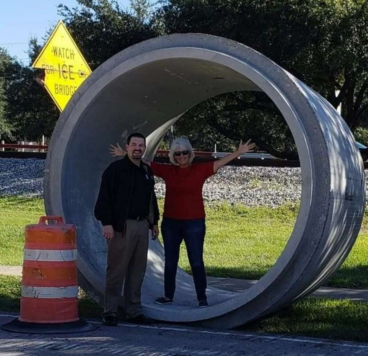 Katy City Councilman Chris Harris and City Councilwoman Janet Corte check out the 8-foot diameter storm sewer pipes that will be used in the First Street project that includes flood mitigation and a road upgrade.