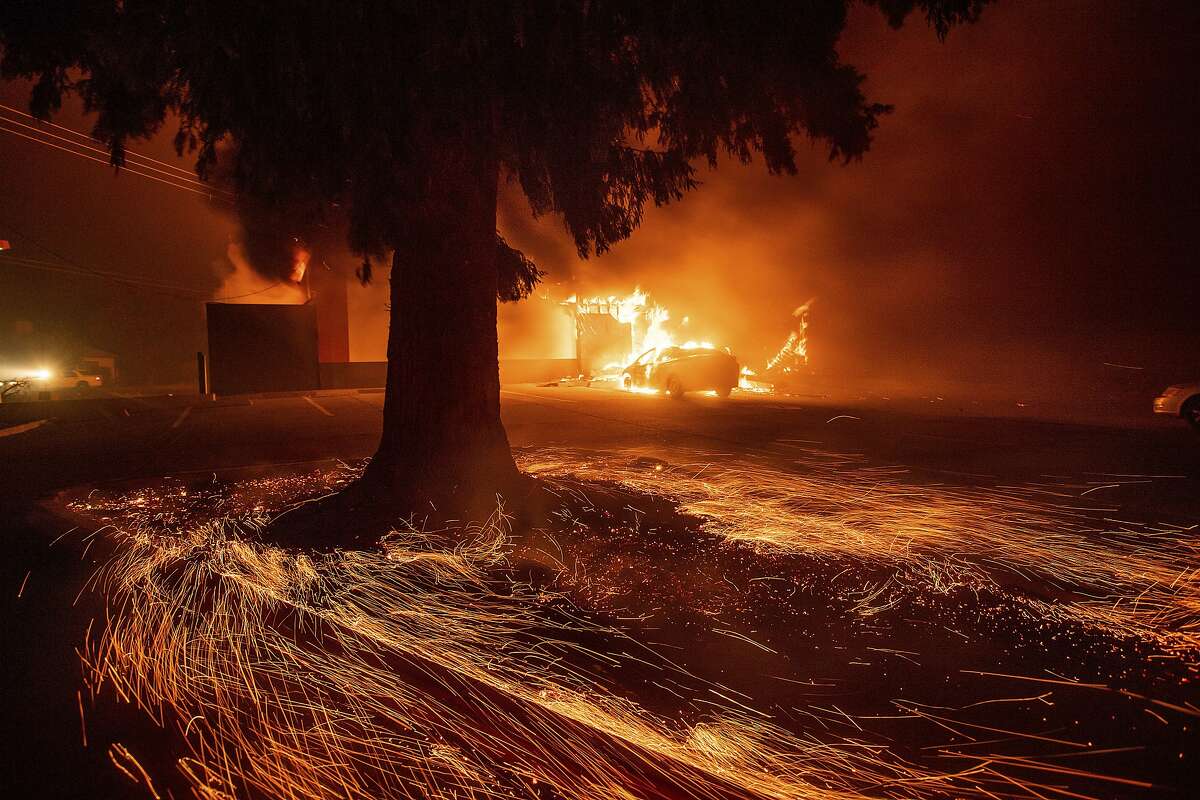 Flames consume a Kentucky Fried Chicken as the Camp Fire tears through Paradise, Calif., on Thursday, Nov. 8, 2018. (AP Photo/Noah Berger, File)