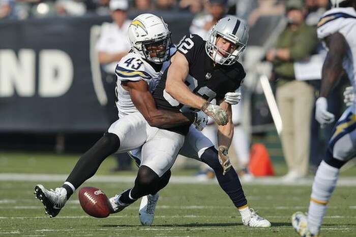 Oakland Raiders wide receiver Antonio Brown holds his jersey during an NFL  football news conference, Wednesday, March 13, 2019, in Alameda, Calif. (AP  Photo/Ben Margot)