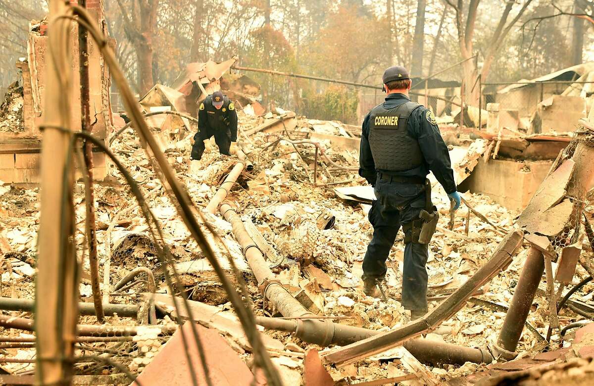 Alameda County Sheriff Coroner officers search for human remains after the Camp fire tore through the region in Paradise, California on November 12, 2018. - Thousands of firefighters spent a fifth day digging battle lines to contain California's worst ever wildfire as the wind-whipped flames cleaved a merciless path through the state's northern hills, leaving death and devastation in their wake. The Camp Fire -- in the foothills of the Sierra Nevada mountains north of Sacramento -- has killed 29 people, matching the state's deadliest ever brush blaze 85 years ago. More than 200 people are still unaccounted for, according to officials.