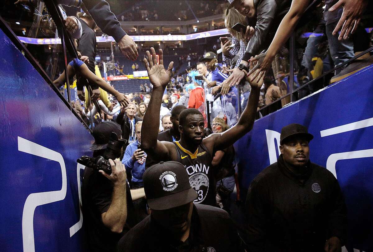 Draymond Green (23) is high fived after the Golden State Warriors defeated the New Orleans Pelicans 131-121 at Oracle Arena in Oakland, Calif., on Wednesday, October 31, 2018.
