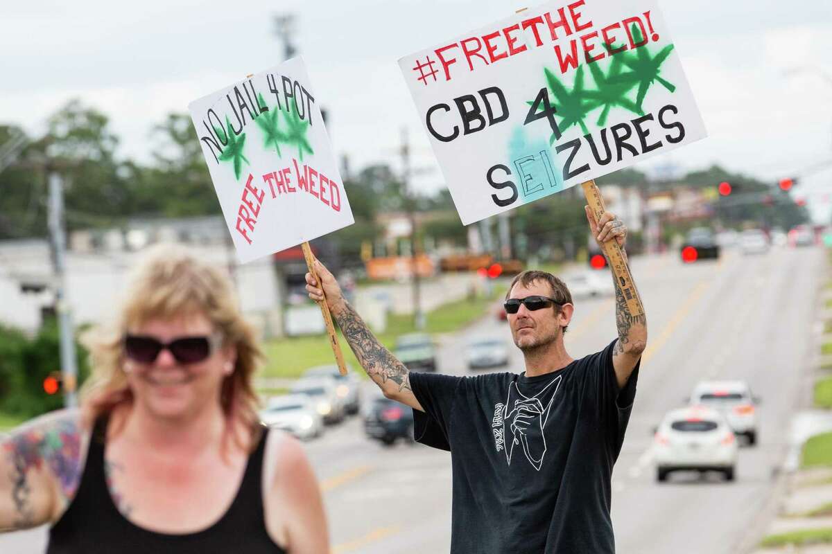 Montgomery resident JT Thomas participates in the Cannabis Open Carry Walk on Saturday, Aug. 4, 2018, off of North Loop 336 in Conroe.