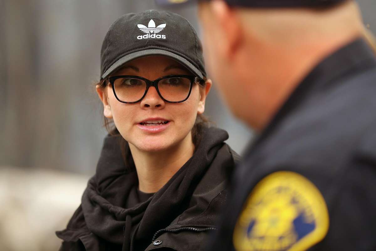 Butte County Investigator Tiffany Larson speaks to Alameda County Sheriff's Dept.  Sgt.Howard Baron after Camp Fire in Paradise, California on Monday, November 12, 2018.