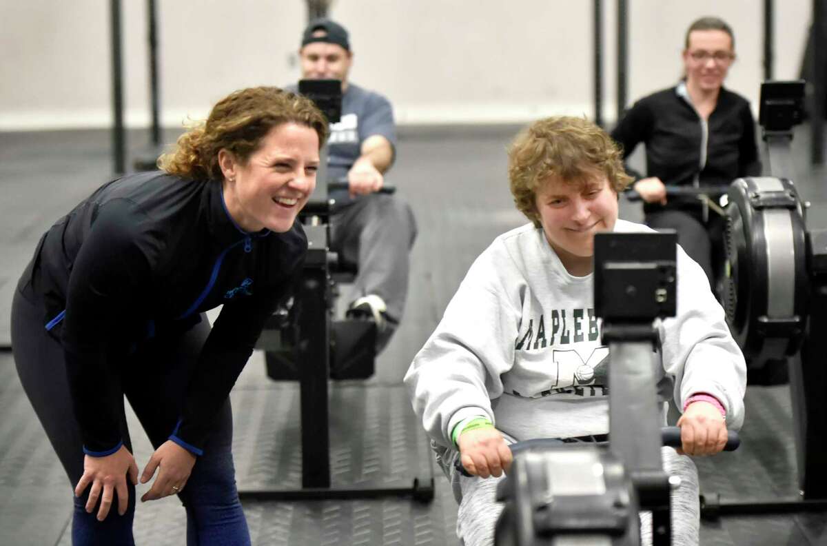 Madison, Connecticut, November 12, 2018: Co-manager and coach Michelle Menard of Hammonasset (CQ) CrossFit of Madison watches Andrea of Westbrook, a Vista Life Innovations student, workout.