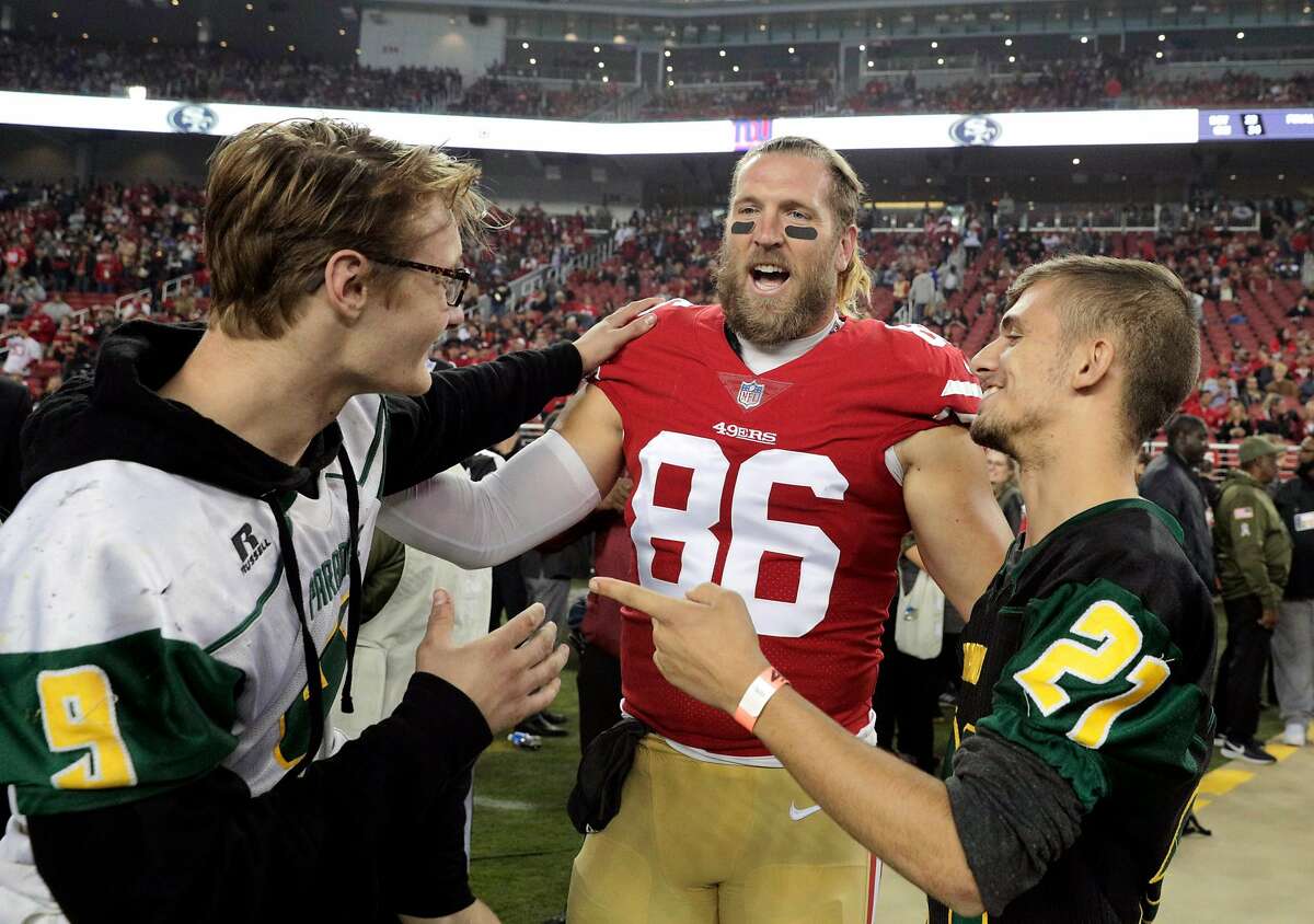 Kaleb Nelson (9) and Austyn Swarts (21) chat with 49ers Kyle Nelson (86) before the national anthem as the San Francisco 49ers played the New York Giants at Levi's Stadium in Santa Clara, Calif., on Monday, November 12, 2018.