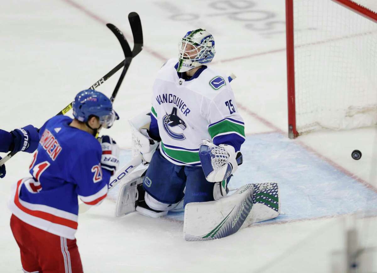 Vancouver Canucks goaltender Jacob Markstrom (25) reacts after New York Rangers' Brett Howden (21) scored a goal during the third period of an NHL hockey game Monday, Nov. 12, 2018, in New York. The Rangers won 2-1. (AP Photo/Frank Franklin II)