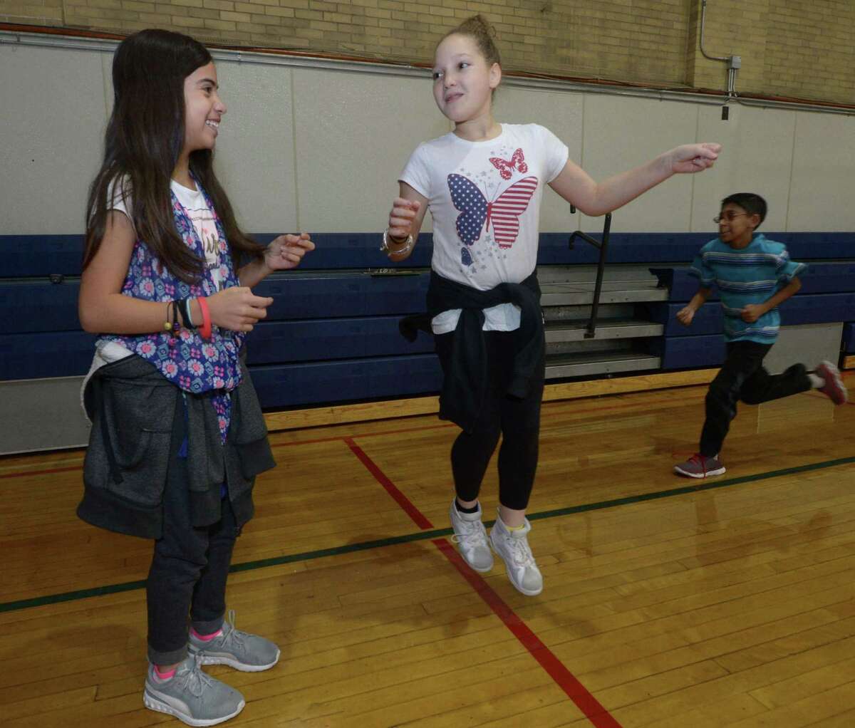 Nathan Hale Middle School students participate in warm-up exercises during a physical education class at the school in Norwalk, Conn. October 26, 2017.