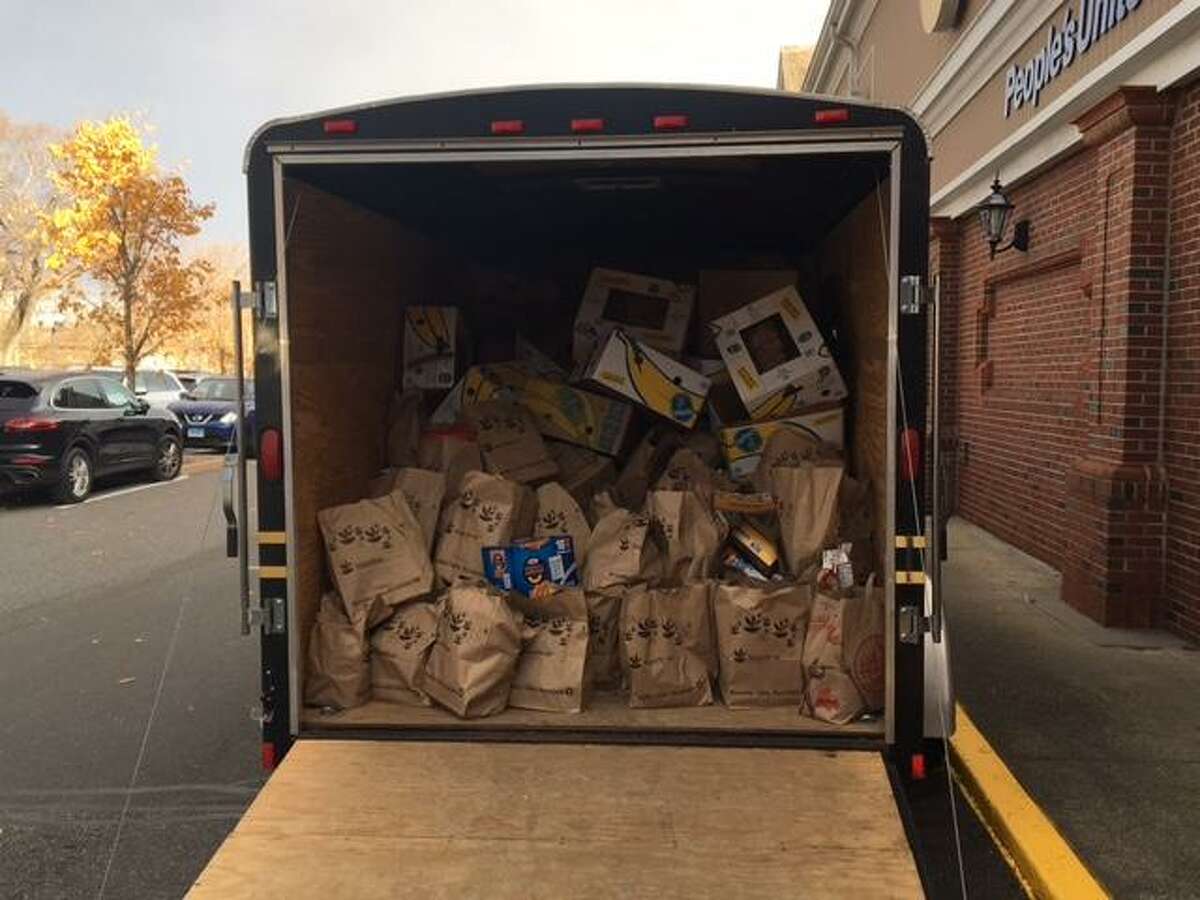 A truck loaded with more than two tons of food stands outside the Stop & Shop at 1790 Post Road East Nov. 10. The cargo will be delivered to the Bridgeport Rescue Mission and was collected during the annual Holiday Food Drive in which Westport police participated.