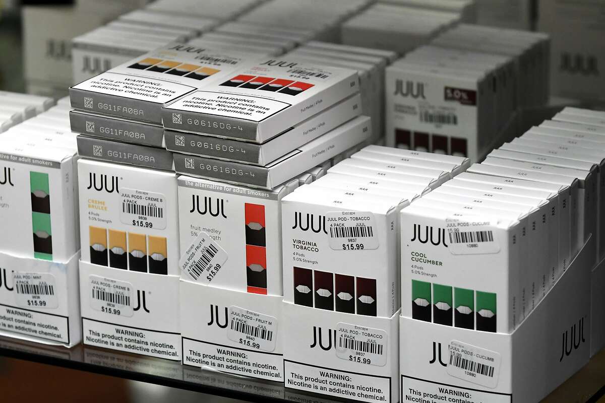 JUUL electronic cigarettes are displayed at Exscape Smoke Shop on Friday, Nov. 9, 2018, on Western Ave. in Albany, N.Y. New York's Department of Health has rescinded proposed regulations seeking to ban flavored e-cigarettes and e-liquids, after industry insiders raised concerns over the legality of such an action. (Will Waldron/Times Union)
